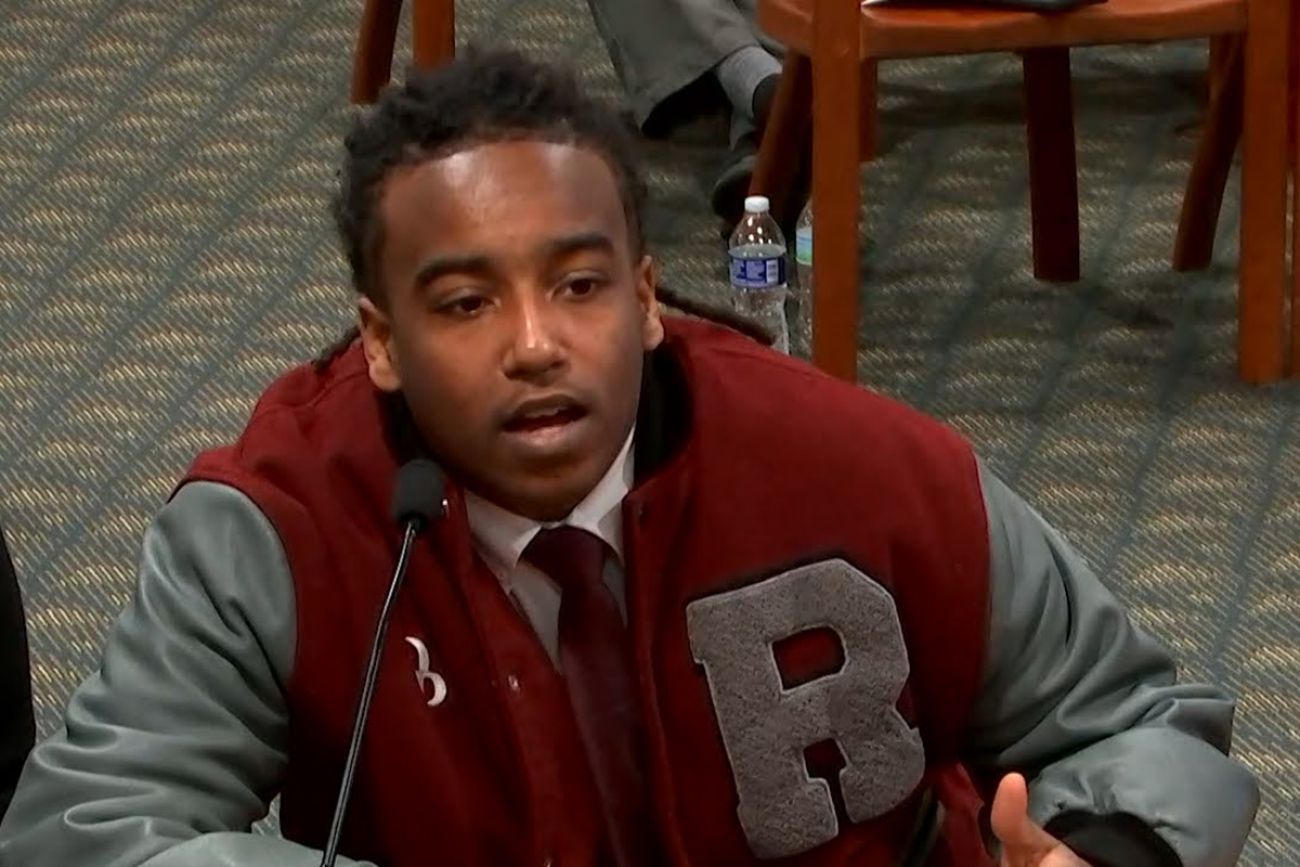 Kyari Brown speaking into a microphone to the Michigan House of Representatives. 