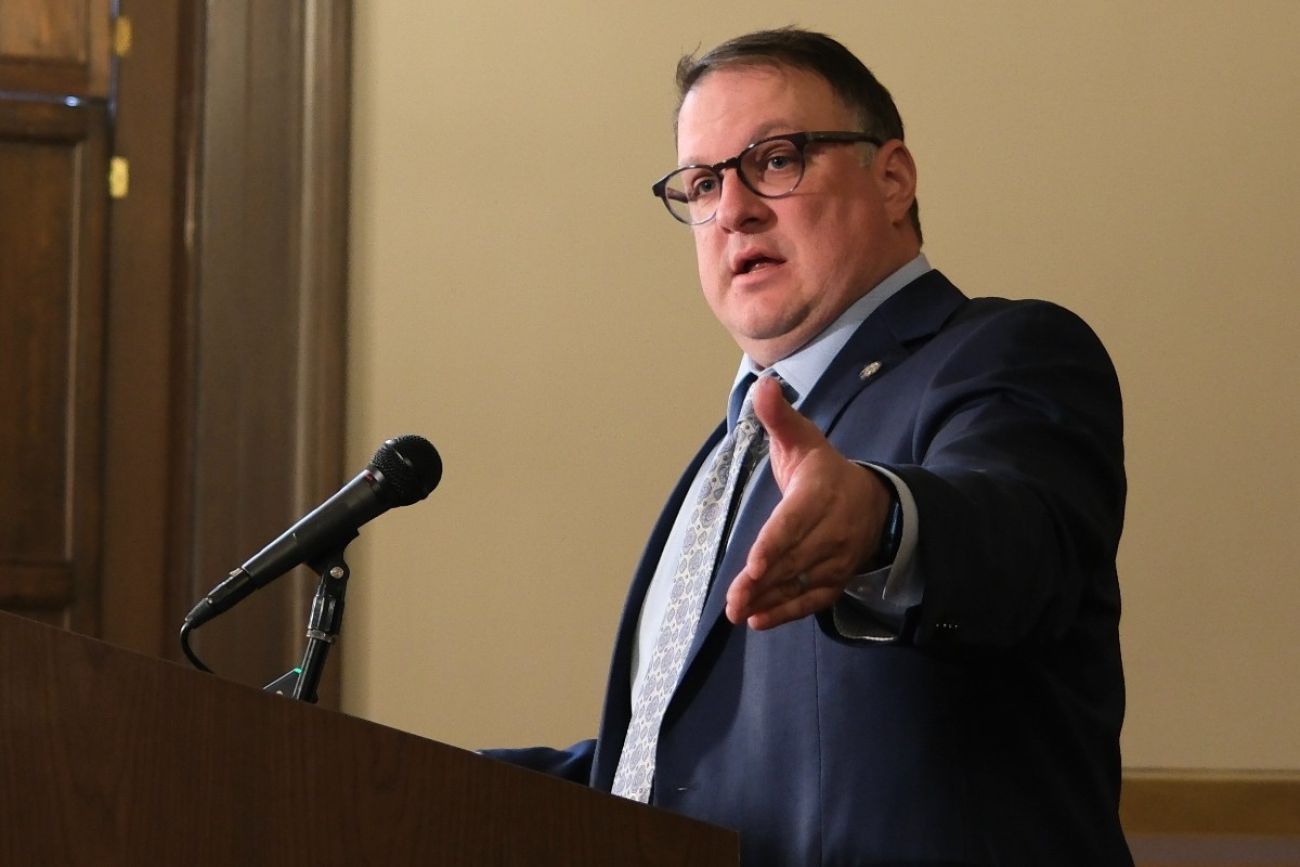 House Speaker Matt Hall speaking into a microphone. 