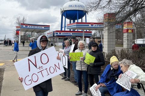 Marianne Pitts, center in white jacket, joined several hundred people in Big Rapids in 2023, lining both sides of South State Street to protest Gotion.