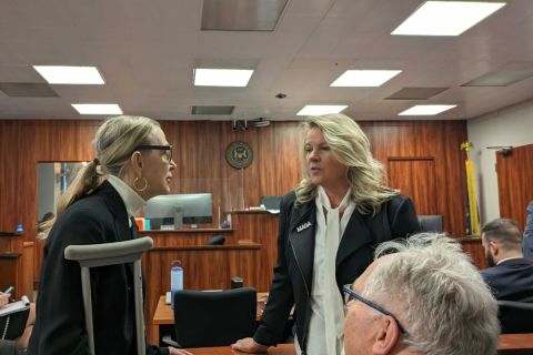 Michele Lundgren and Meshawn Maddock in a courtroom. 